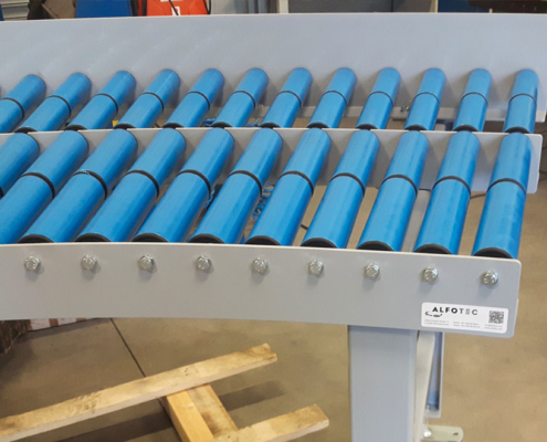 idlers on conveyor system blue