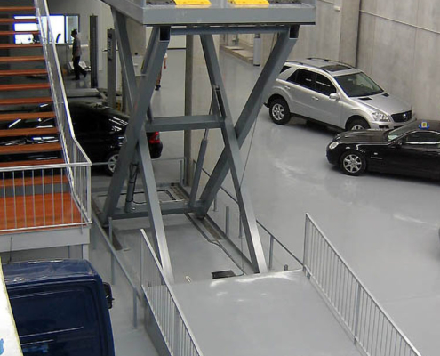 extended lift table in car dealership