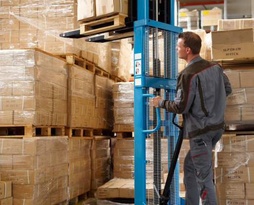 warehouse staff operating high-lift trucks with pallets and packages